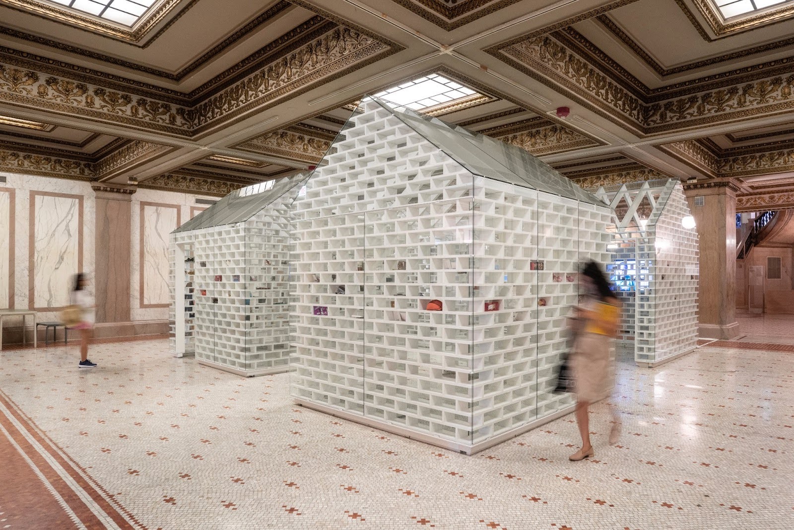 People viewing The Gun Violence Memorial Project on exhibition at the Chicago Cultural Center for the Chicago Architecture Biennale in 2019. Image Credit: MASS Design Group, Photograph by Chicago Architecture Biennale, 2019.